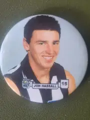 JON HASSALL NO 15 - COLLINGWOOD MAGPIES AFL TIN BADGE CIRCA 1990's