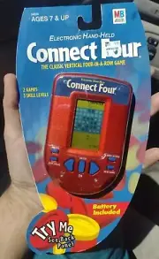 2002 Milton Bradley electronic hand- held connect four new in package