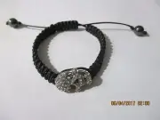 BRACELET CRYSTAL PIRATE FACE WITH BLACK PULL STRING CLOSURE