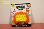 Toy Planet Pop Pop Poppers Light Up Sensory Fidget Toy Game Orange