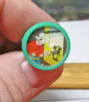 plastic 1960s dime store vending machine toy Flicker Ring, Cowboy at window, grn