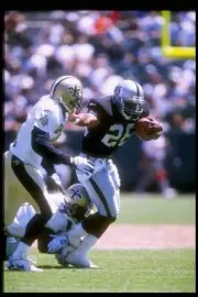 Running back Napoleon Kaufman Oakland Raiders moves the ball at a - Old Photo