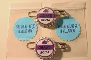 Set of 2 Replica ELLIE BADGE GRAPE SODA BOTTLECAP PINS! UP & 2 Sticker Gift Bags