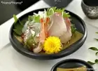 Black glaze and gold pattern round sashimi plate with an angular de From Japan