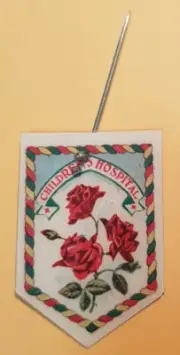 Vintage Children Hospitals Appeal Day Celluloid Pin featuring roses