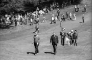 Jack Nicklaus walking with official on the fairway during Saturday- Old Photo