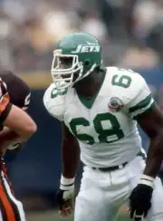 Offensive lineman Reggie McElroy New York Jets looks on from the f- Old Photo