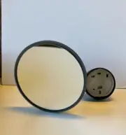 Tondo round mirror magnifying mirror light in matt black from Parisi