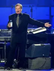 Actor comedian Robin Williams performs during Andre Agassi's Grand - Old Photo