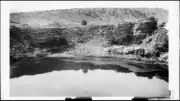 Reflection in water of Montezumas Well near Indian cliff dwellings - Old Photo