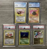 Graded Pokémon Lot x5; CGC Golem 1996 Japanese 8.5, CGC Eevee 1999 8.5, PSA 1999
