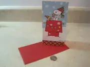 1 PEANUTS SNOOPY CHRISTMAS CARD WOODSTOCK DOGHOUSE GLITTER SNOW FLAKES * CUTE