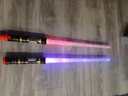 Light Sabers. Light Up And Stay On Until You Turn Them Off. They Make Noise And