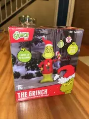 4 ft. LED The Grinch in Ugly Sweater Candy Cane Christmas Airblown Inflatable