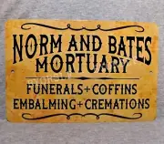 Metal Sign NORM and BATES MORTUARY funerals coffins death Mortician 8" x 12"