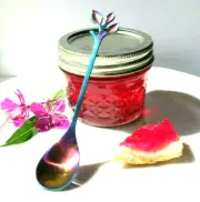 Alaska Fireweed Jelly in Mason Jar with a Decorative Serving Spoon