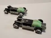 2 Original Johnny Lightning pull Back T-Jet Style NOS Chassis HO Scale Car's