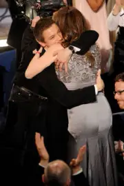 Actor Jeremy Renner hugs director Kathryn Bigelow onstage at the 8- Old Photo
