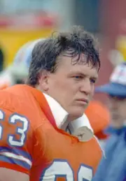 Offensive lineman Mark Cooper Denver Broncos looks on from the sid- Old Photo