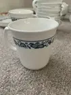 Corelle Old Town Blue mugs, tea cups, saucers, and open sugar bowl