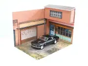 Diorama street garage scene. Scale 1:24. Street store display with garage door.