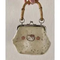 在飛比找蝦皮購物優惠-Hello Kitty 手提包 夾子包 透明 pvc 竹柄 
