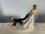 Bride Groom Wedding Day Reception Cake Topper Bride pulling grooms foot