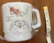 Sanrio Japan Doraemon Meets Hello Kitty White Cup Mug Red Bows Anywhere Door