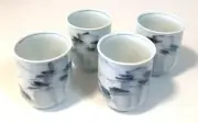 Set of four blue and white porcelain tea cups