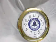 Wall clock with Public Telephone/Bell System logo on face- gold color