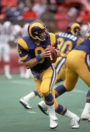 Quarterback Jeff Kemp Los Angeles Rams drops back to pass against - Old Photo