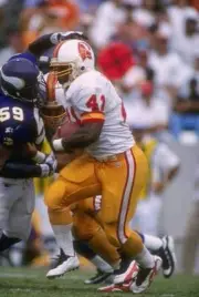 Running back Reggie Brooks Tampa Bay Buccaneers makes a cut to - 1996 Old Photo