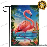 Elegant Flamingo in Tropical Garden with Exotic Flowers and Lush Greenery