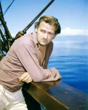 Percy Herbert leans on a ships gunwale in a scene from Mutiny on t- Old Photo