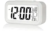 Poeroa Digital Alarm Clock,Battery Operated Small Desk Clocks,with Date,Indoor Temperature,Smart Night Light,LCD Electronic Clock for Bedroom Home Office - White