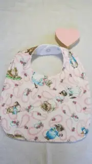Handmade bib- Beatrix Potter, Peter Rabbit on pink paisley