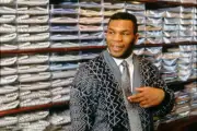 Mike Tyson poses for a photo while fitted for a suit during a phot- Old Photo 1