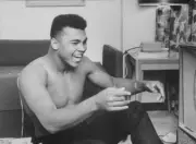 Cassius Clay laughing while watching himself on television Clay wo- Old Photo