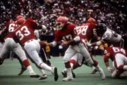 Quarterback Brian Sipe hands of the ball to Running Back Maurice - Old Photo