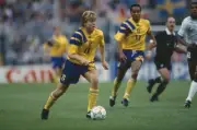 Swedish footballer Tomas Brolin makes a run with the ball as teamm- Old Photo