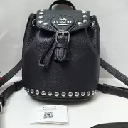 Coach Black Pebbled Leather Studded Drawstring Crossbody Backpack Bag - NWT $450