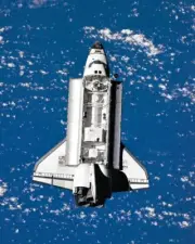 8x10 Color photo of the Space Shuttle Discovery from the Space Station Mir.