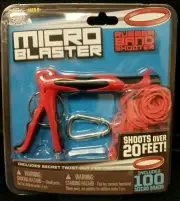 New Sealed Micro Blaster Rubber Band Shooter Toy By Hog Wild 20ft Range C5-7
