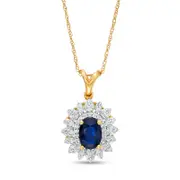 Oval Blue Sapphire and 0.2 CT. T.W. Natural Diamond Flower Frame Pendant in 10K Yellow Gold