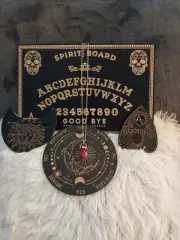 Ouija board/spirit board, planchet, pendulum board with a red crystal pendulum