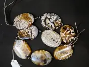 STRING OF STRIKING FLAT OVAL BEADS OF UNKNOWN AFRICAN STONE