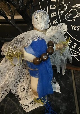 Intriguing Blue And white voodoo, doll to invoke, peace, tranquility Protection