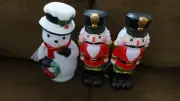Two Plastic 12" Nutcracker Decorations and One 12" Snowman that Light Up
