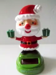 Solar Powered Dancing Bobble Head Santa - Holding Two Presents