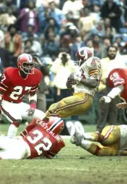 Running back Larry Brown Washington Redskins is brought down by a- 1974 Photo